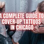 Popular Cover-Up Tattoo Styles in Chicago When it comes to cover-ups, certain tattoo styles are better suited to hiding old tattoos. Here are a few popular tattoo styles seen in Chicago that can help you transform an old tattoo into a stunning new piece: Black and Grey Realism: This style uses shading and depth to cover old tattoos with a new, hyper-realistic design. It’s perfect for portraits, nature scenes, or anything with intricate details. Neo-Traditional: Neo-traditional designs are bold, vivid, and detailed, making them an excellent choice for covering up faded or poorly done tattoos. A Complete Guide to Cover-Up Tattoos in Chicago